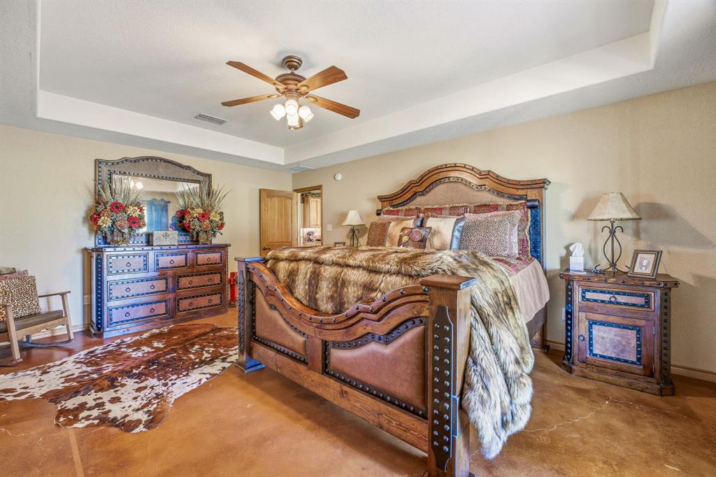 2548 Fm 1496 Dublin, TX 76446 - Photo 14 of 40 a bedroom with a bed and wooden floor