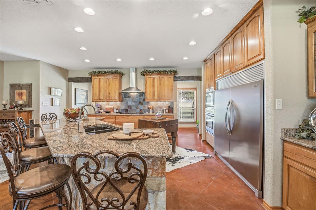 2548 Fm 1496 Dublin, TX 76446 - Photo 7 of 40 a kitchen with stainless steel appliances granite countertop a refrigerator a stove and a sink with wooden floor