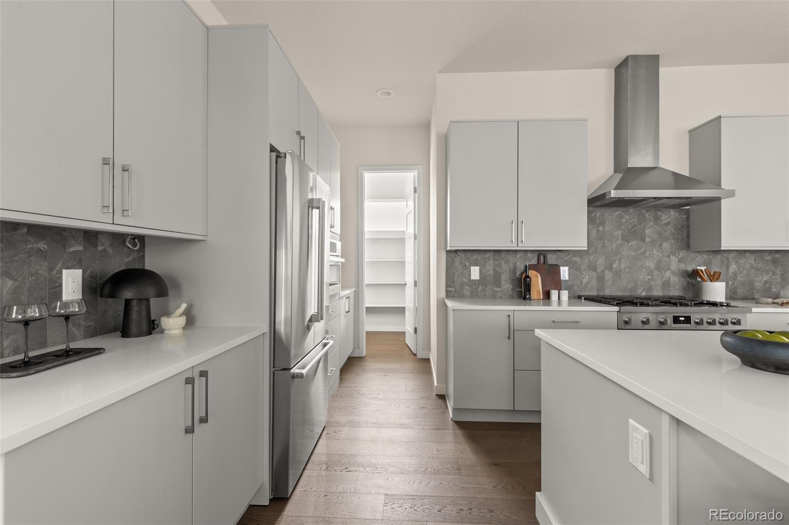 11332 Alla Breve Lone Tree, CO 80134 - Photo 12 of 50 a kitchen with a sink a stove and cabinets