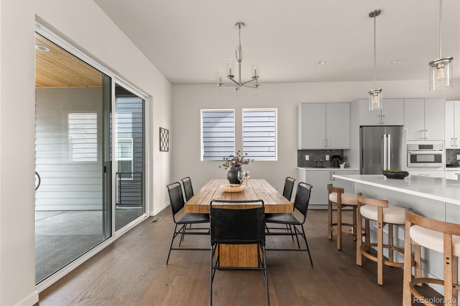 11332 Alla Breve Lone Tree, CO 80134 - Photo 16 of 50 a dining room with furniture and window