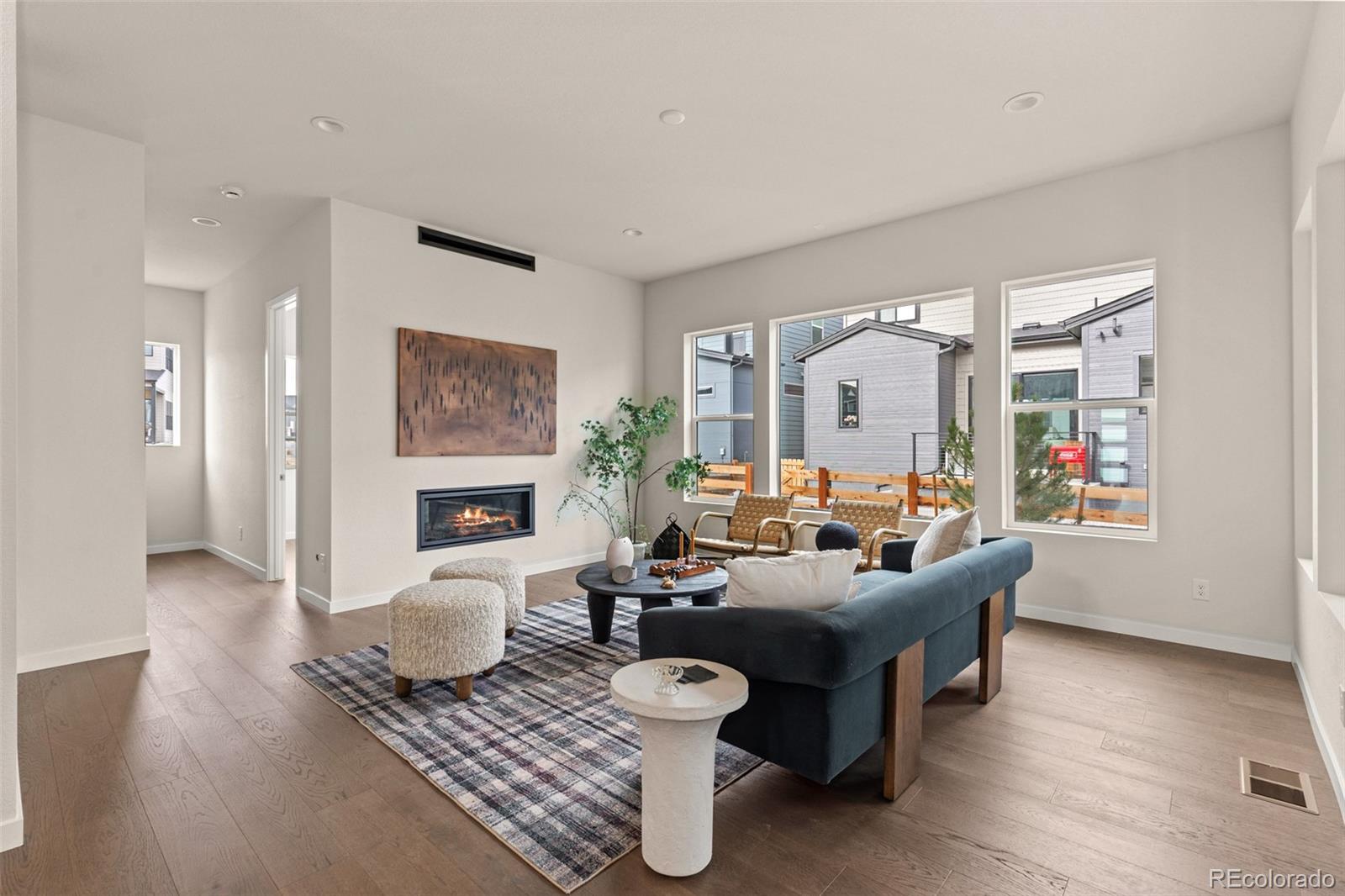 11332 Alla Breve Lone Tree, CO 80134 - Photo 19 of 50 a living room with fireplace furniture and a large window