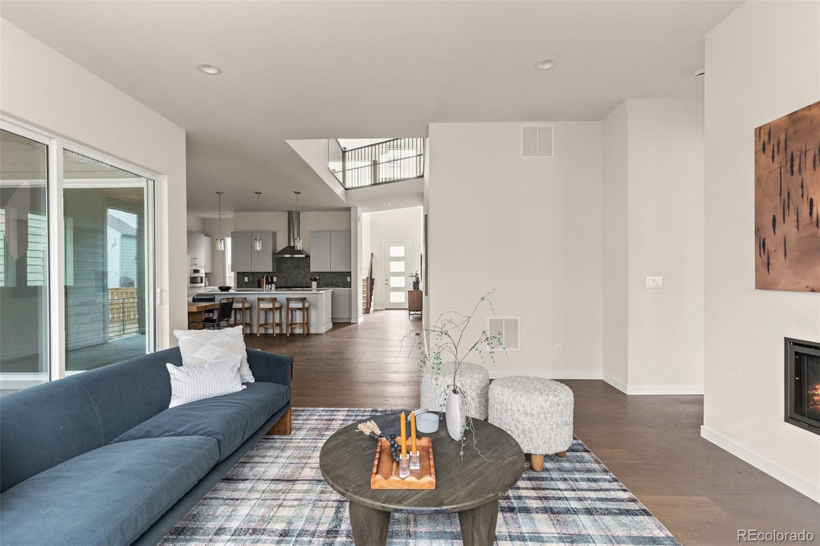 11332 Alla Breve Lone Tree, CO 80134 - Photo 24 of 50 a living room with furniture and a dining table