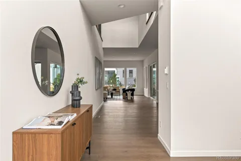 a view of a livingroom with furniture and wooden floor