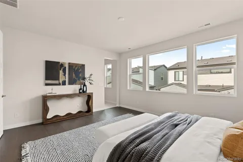 a bedroom with bed and window