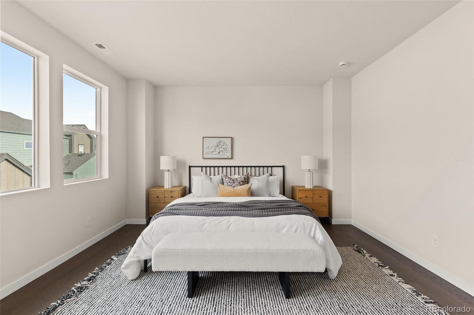 11332 Alla Breve Lone Tree, CO 80134 - Photo 37 of 50 a bed sitting in a bedroom next to a window