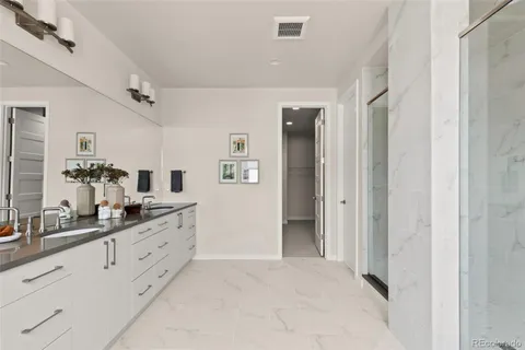 a spacious bathroom with a double vanity sink double and mirror