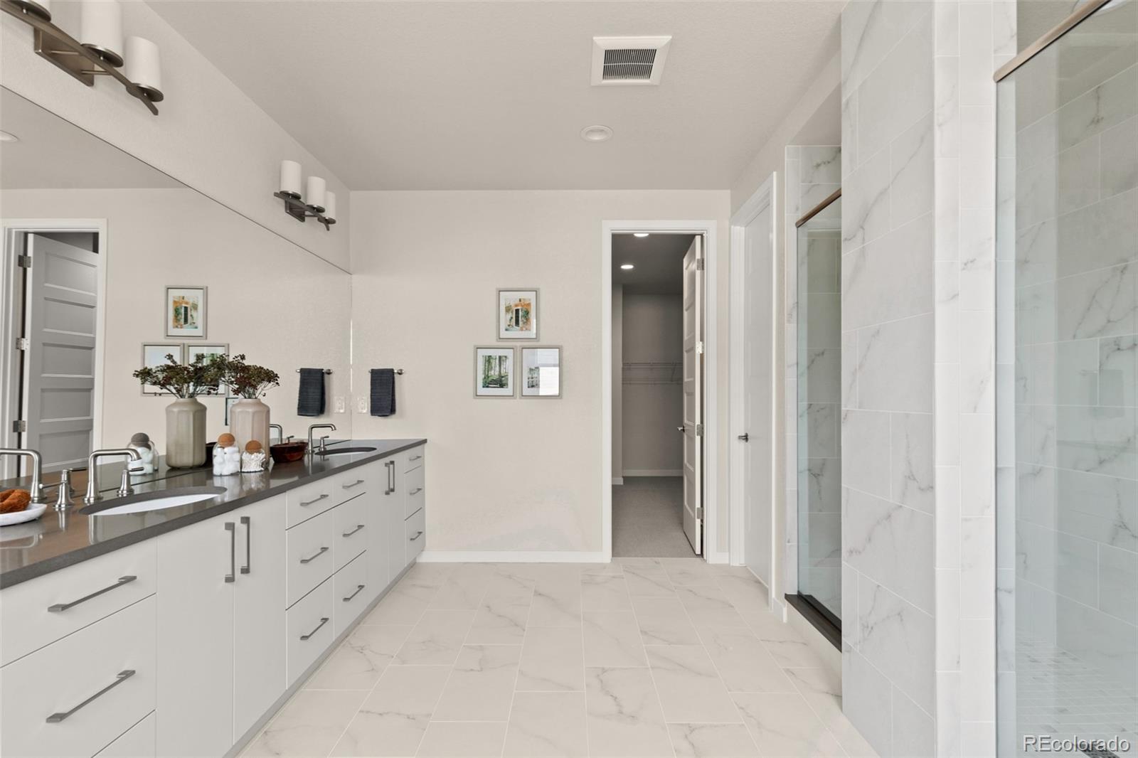11332 Alla Breve Lone Tree, CO 80134 - Photo 38 of 50 a spacious bathroom with a double vanity sink double and mirror