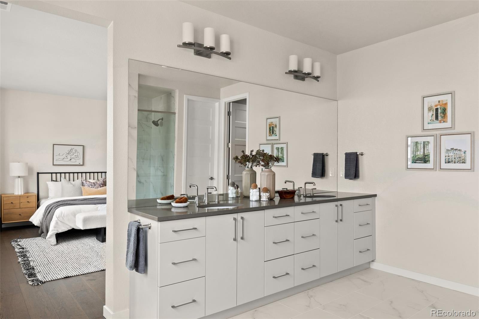 11332 Alla Breve Lone Tree, CO 80134 - Photo 39 of 50 a en suite bathroom with double sink and a mirror