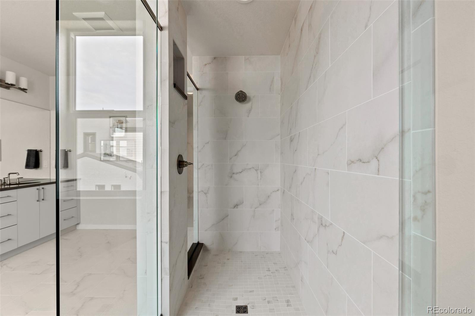 11332 Alla Breve Lone Tree, CO 80134 - Photo 40 of 50 a bathroom with a shower