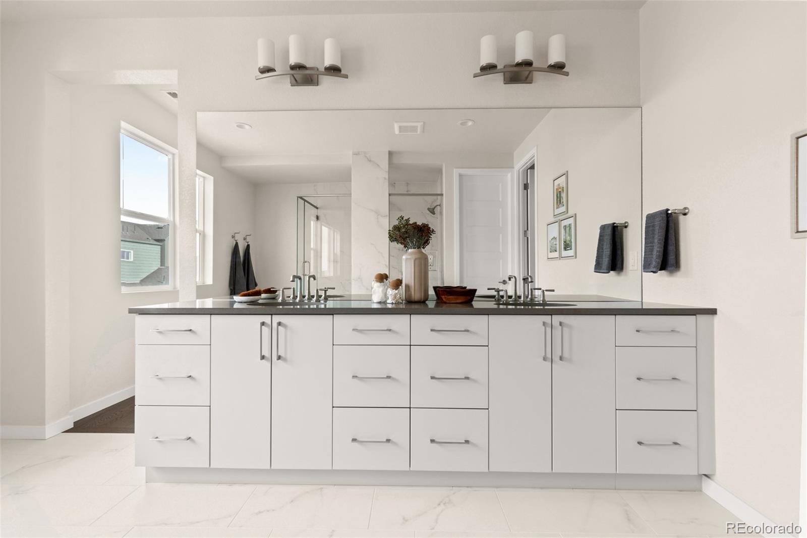 11332 Alla Breve Lone Tree, CO 80134 - Photo 42 of 50 a bathroom with a sink and a mirror