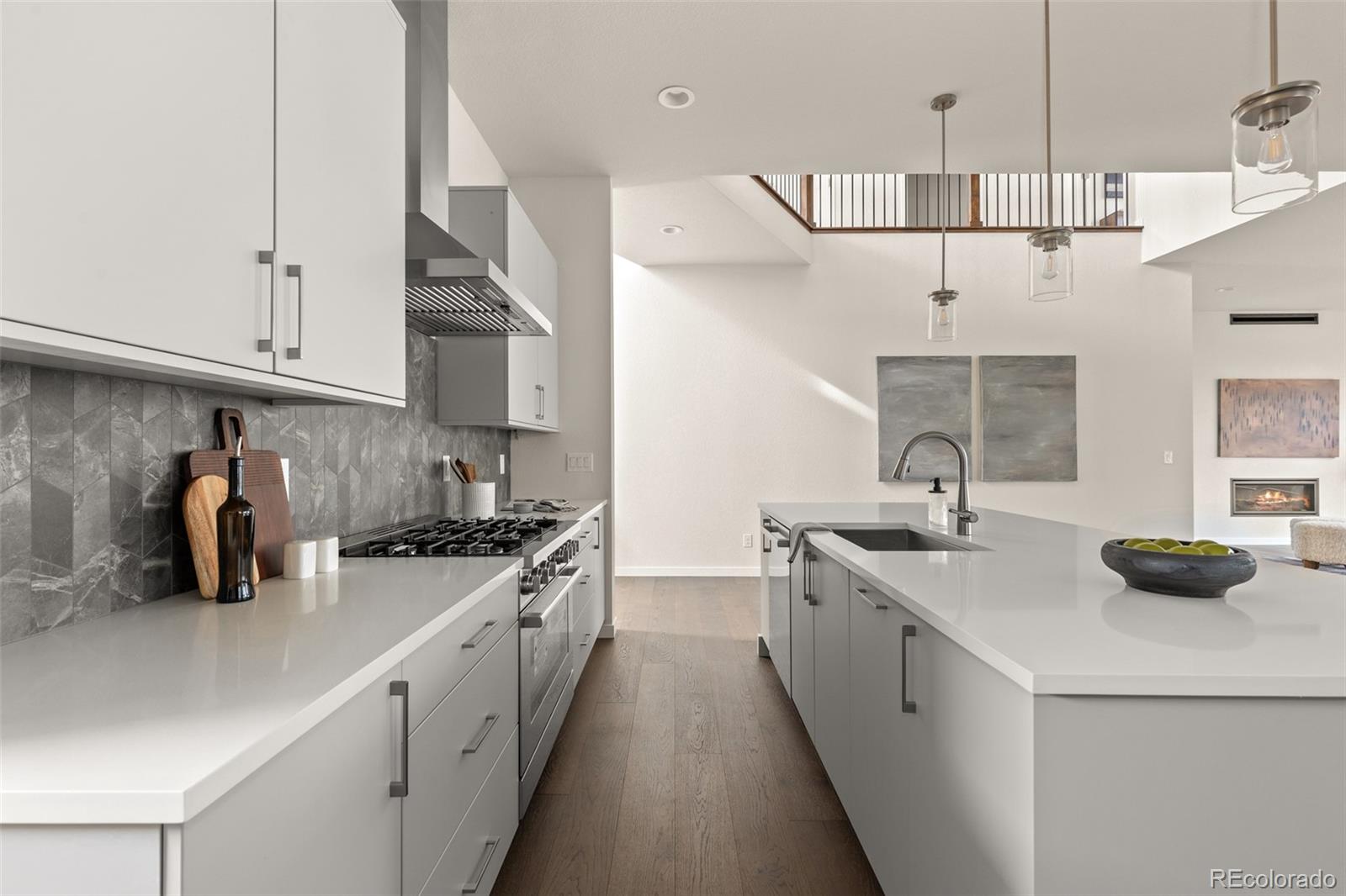 11332 Alla Breve Lone Tree, CO 80134 - Photo 10 of 50 a kitchen with stainless steel appliances a sink stove and cabinets