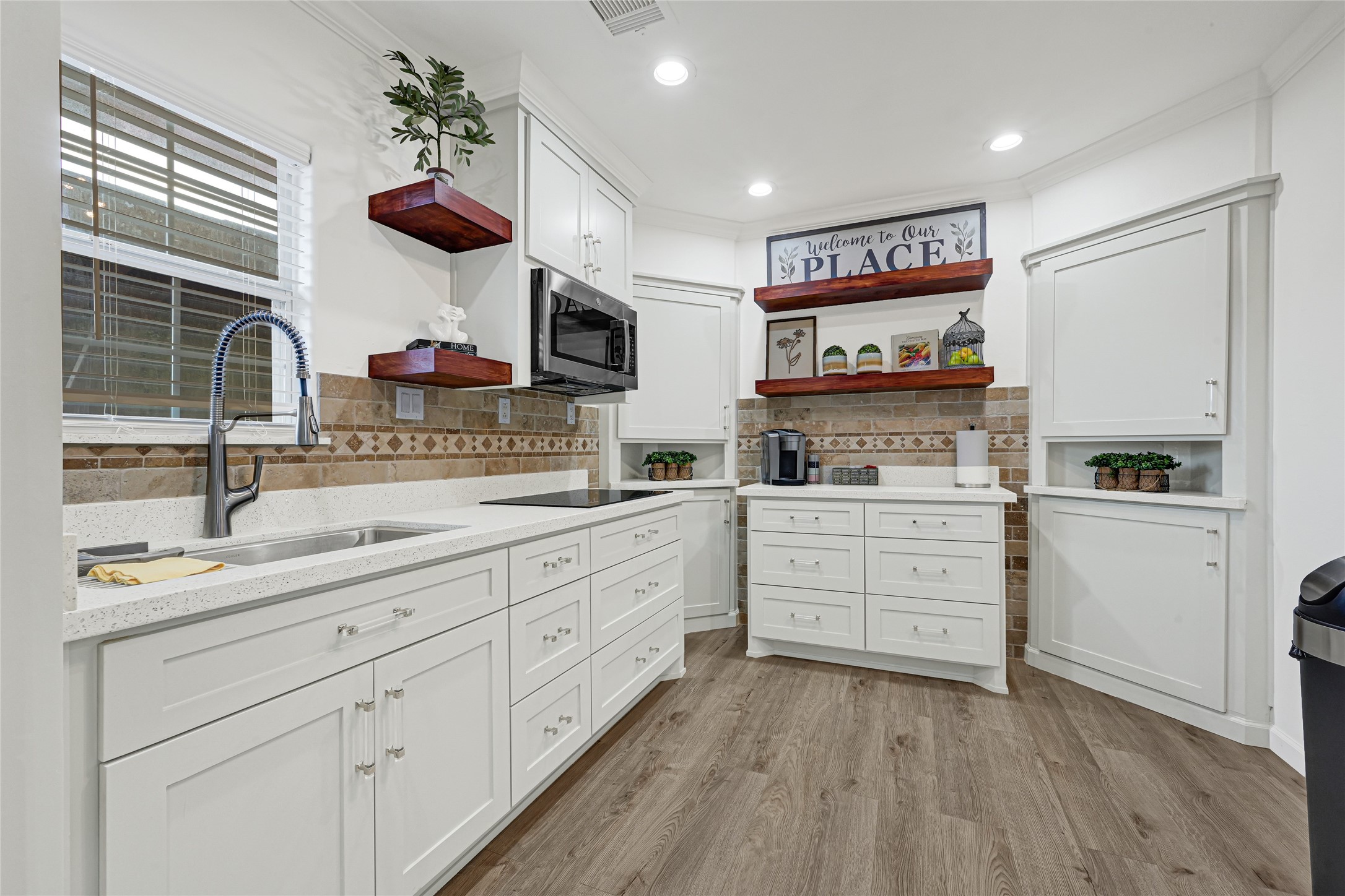 2809 Tooke Street Houston, TX 77023 - Photo 6 of 50 a kitchen with a sink window and cabinets