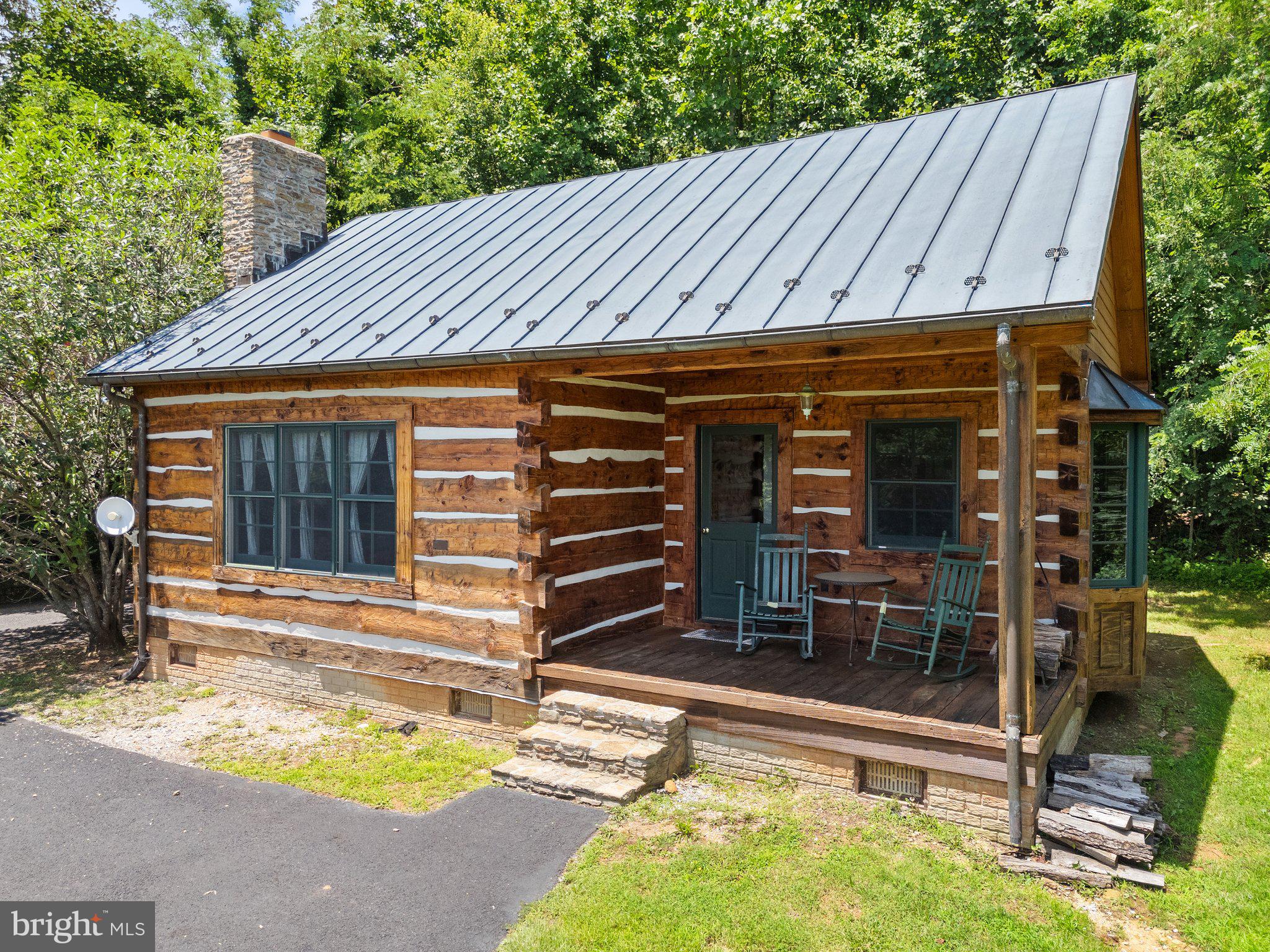 156 Bear Wallow Road Huntly, VA 22640 - Photo 15 of 68 a view of a backyard with a patio and wooden fence