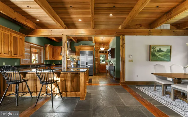 a living room with a couch next to a window