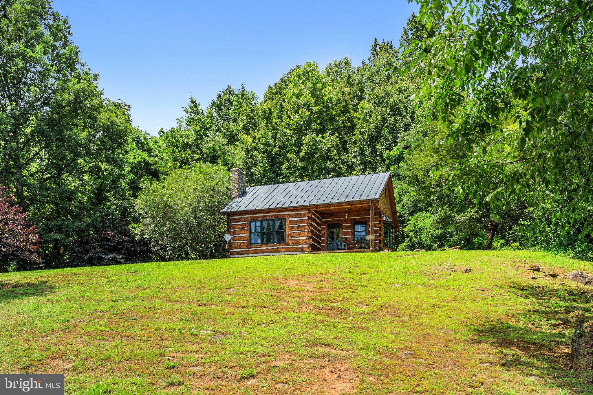 156 Bear Wallow Road Huntly, VA 22640 - Photo 52 of 68 a view of a house with a swimming pool