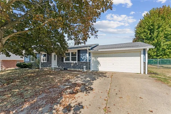 a view of a house with a tree
