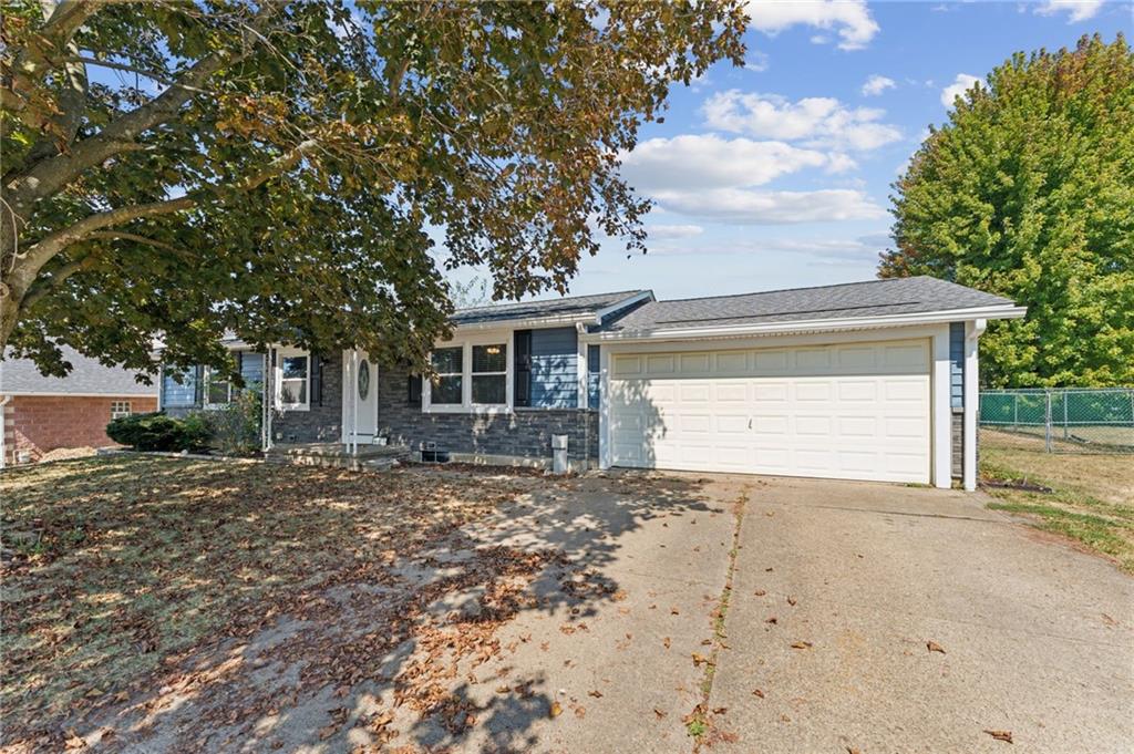 a view of a house with a tree