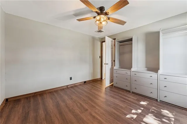 a view of a livingroom with wooden floor