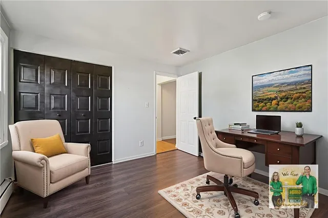 a workspace with furniture and a wooden floor