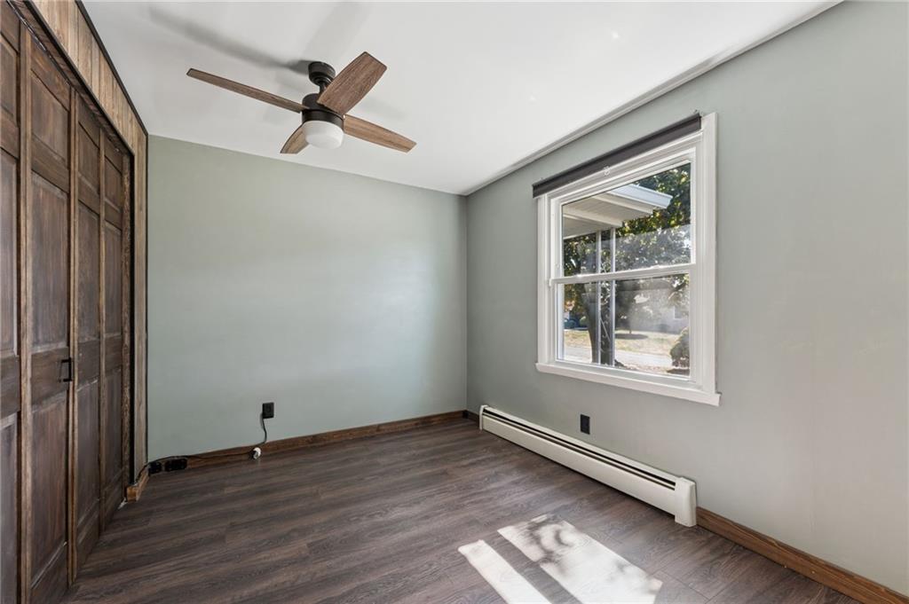 611 Alexander Avenue Monaca, PA 15061 - Photo 24 of 34 an empty room with wooden floor cabinet and windows