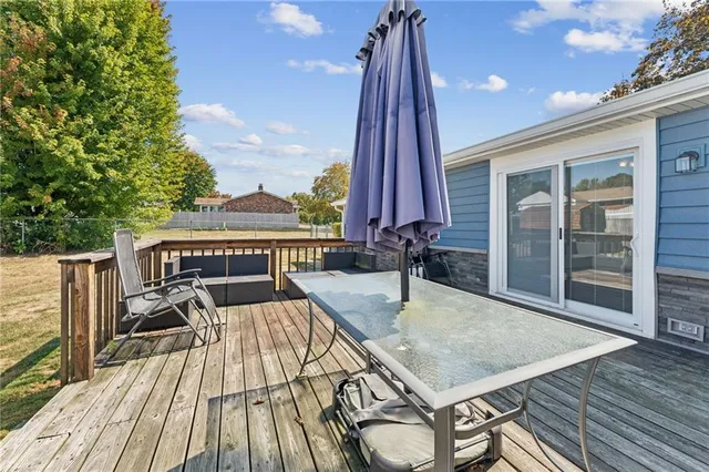 a view of balcony with two chairs and wooden floor