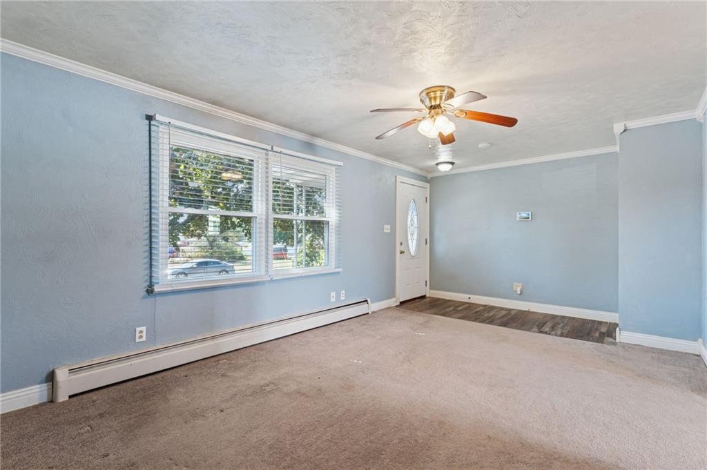 611 Alexander Avenue Monaca, PA 15061 - Photo 6 of 34 an empty room with a window and a ceiling fan
