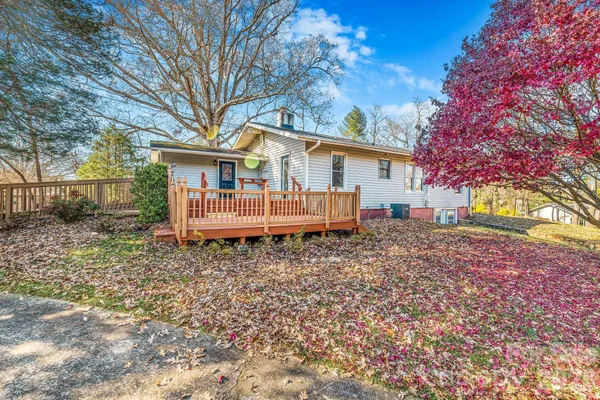 a backyard of a house with a garden and deck