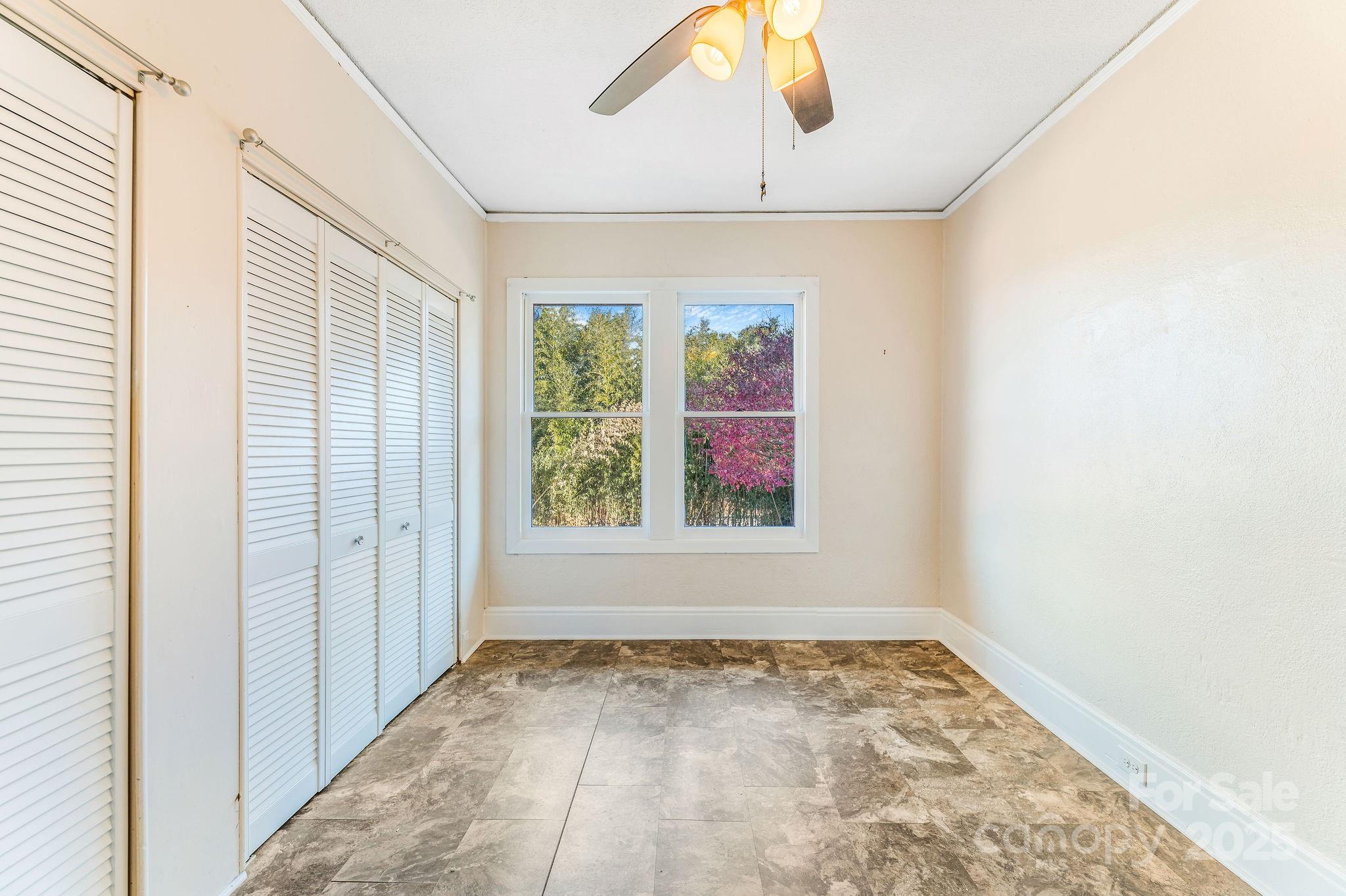 107 Woodland Church Road Clyde, NC 28721 - Photo 11 of 42 an empty room with a window