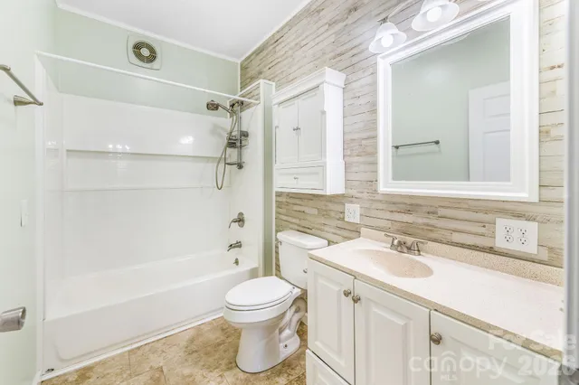 a bathroom with a sink toilet a shower and bathtub