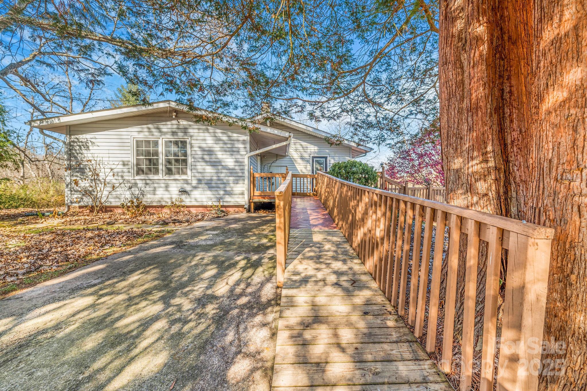 107 Woodland Church Road Clyde, NC 28721 - Photo 2 of 42 a balcony with trees in front of it