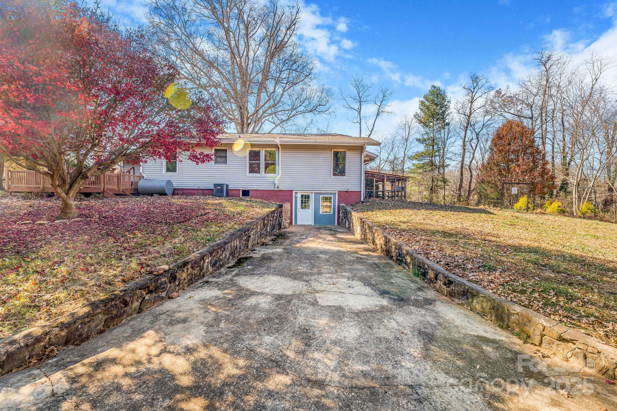 107 Woodland Church Road Clyde, NC 28721 - Photo 27 of 42 a view of a yard covered with snow in the yard