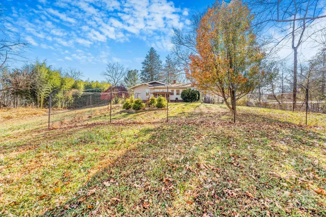 a view of yard and covered with snow