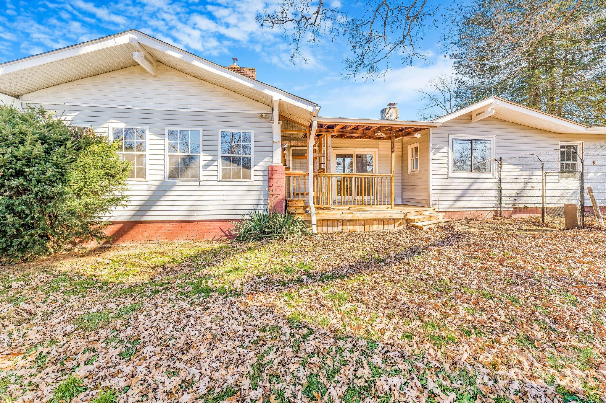 107 Woodland Church Road Clyde, NC 28721 - Photo 37 of 42 a front view of a house with a yard