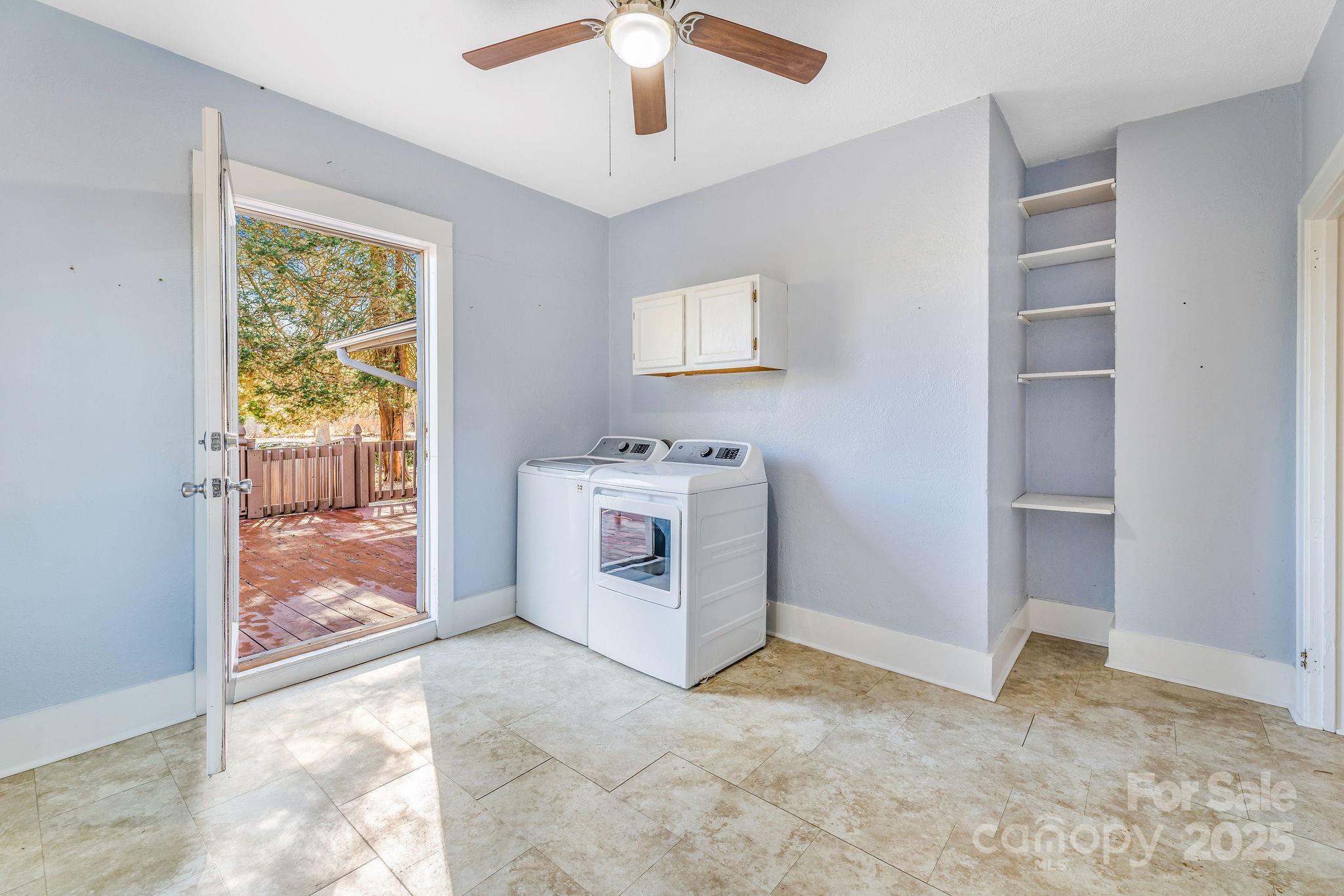 107 Woodland Church Road Clyde, NC 28721 - Photo 4 of 42 a view of a livingroom with a window and a kitchen