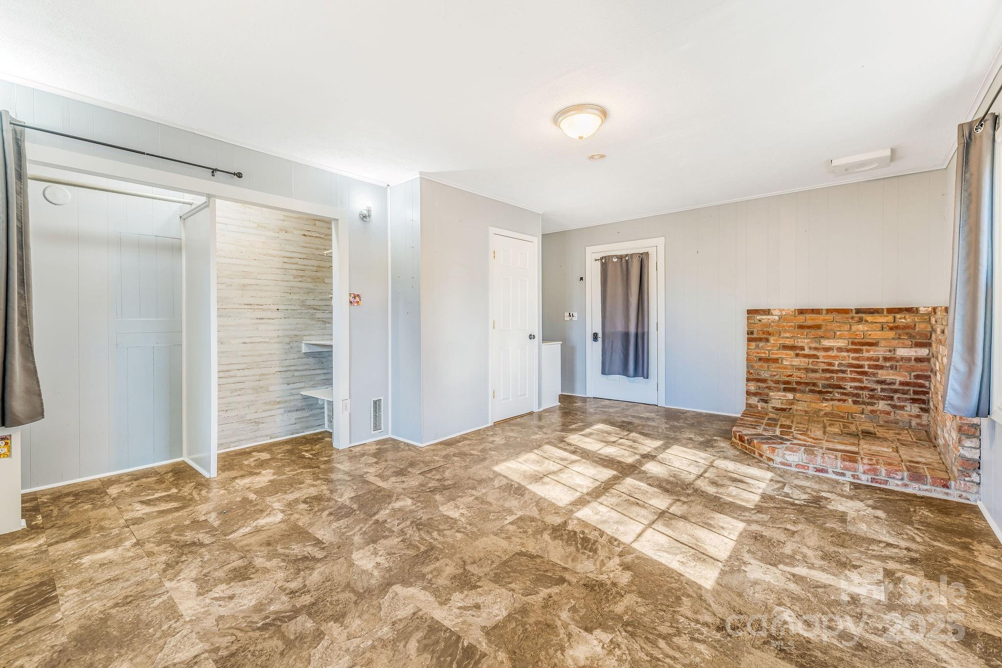 107 Woodland Church Road Clyde, NC 28721 - Photo 6 of 42 a view of an empty room