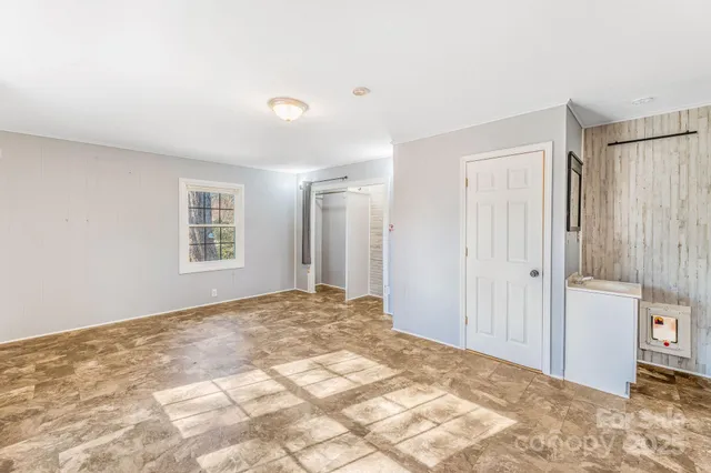 a view of a bedroom with a bedroom