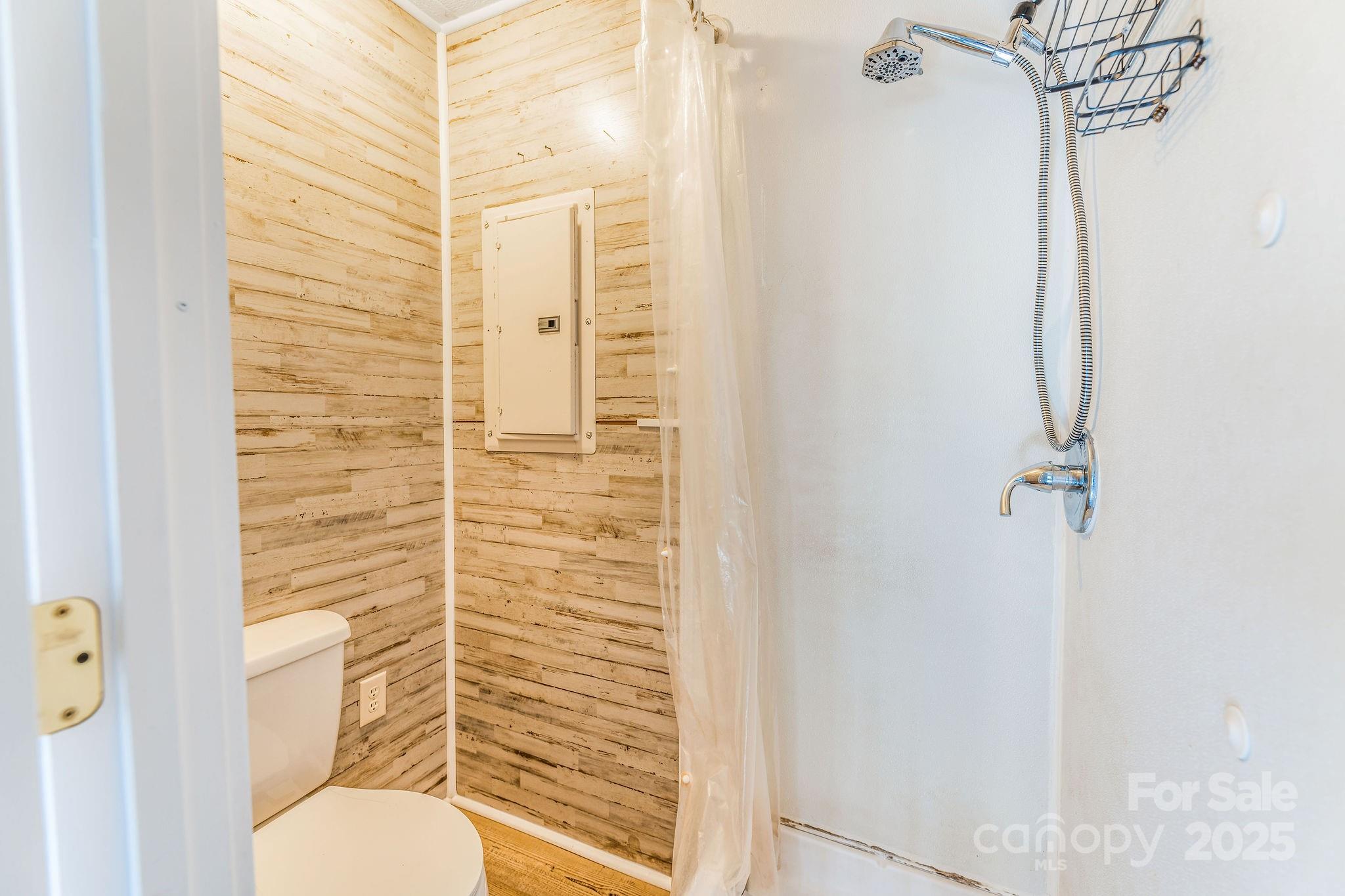 107 Woodland Church Road Clyde, NC 28721 - Photo 8 of 42 a bathroom with a toilet and a shower