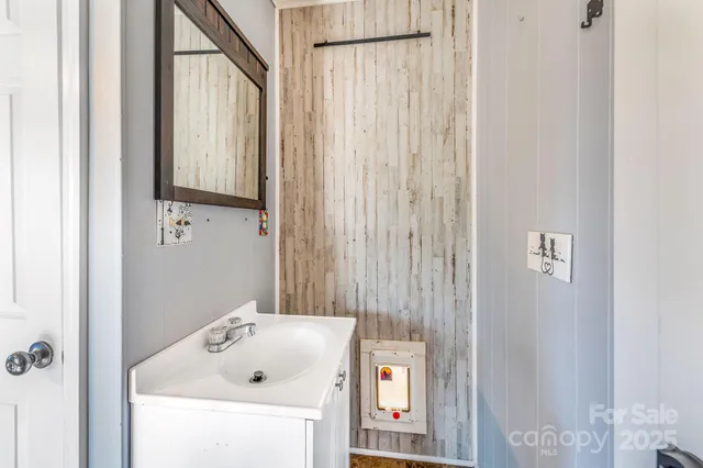 a bathroom with a sink and a shower curtain