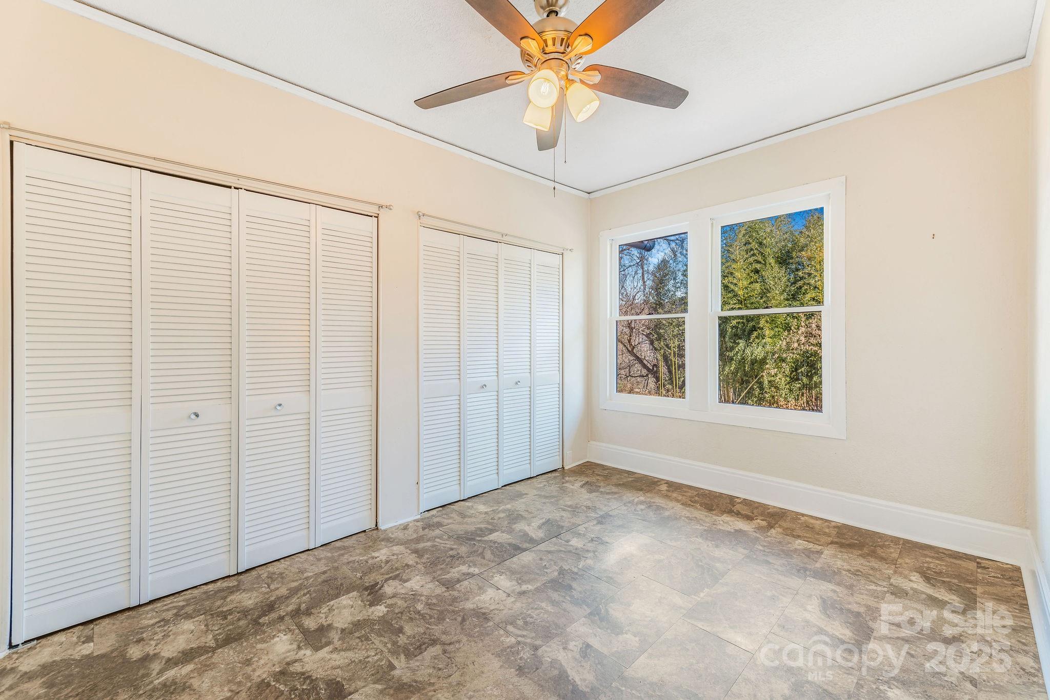 107 Woodland Church Road Clyde, NC 28721 - Photo 10 of 42 an empty room with windows and closet