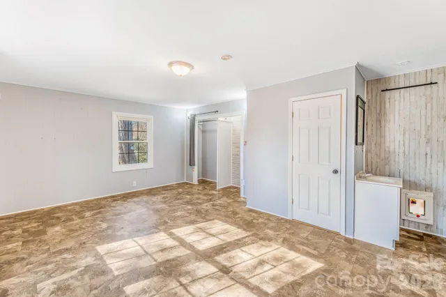 a view of a bedroom with a bedroom