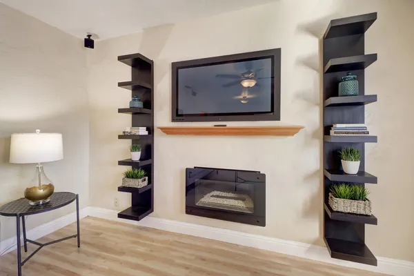 a living room with furniture and a fireplace