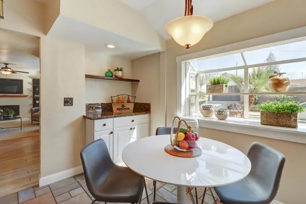 a view of a dining room with furniture window and outside view