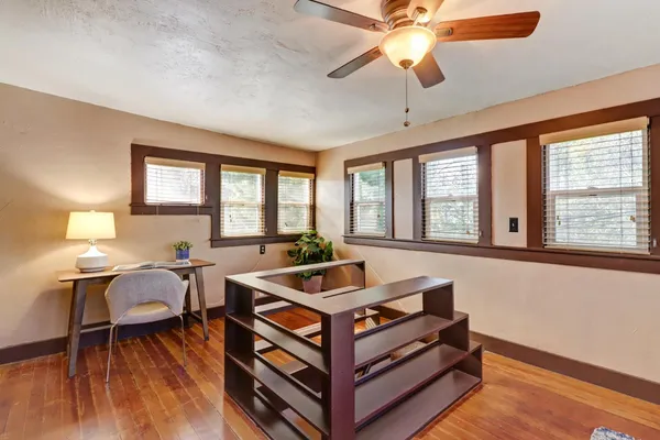 a room with furniture and wooden floor