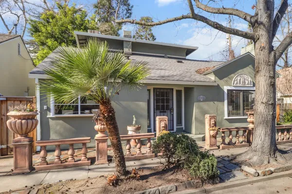 front view of a house with a fountain