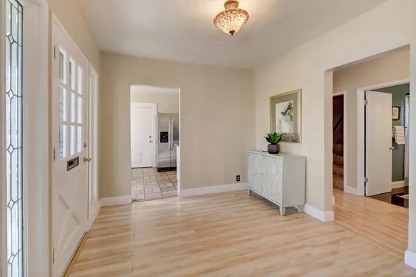 a view of a room with wooden floor and staircase