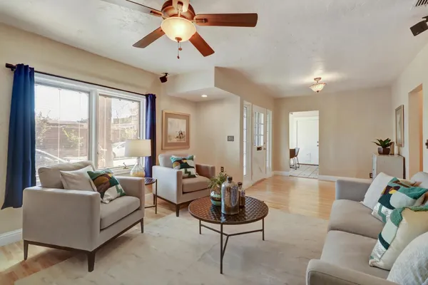 a living room with furniture and a large window