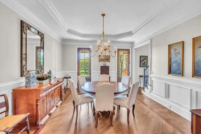 a large kitchen with cabinets table and chairs