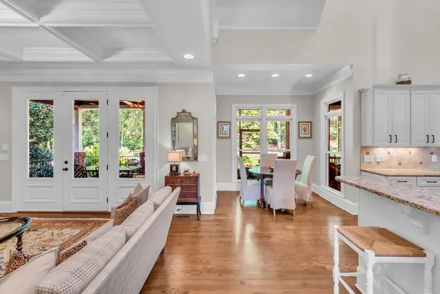 a bedroom with a large bed and a large window