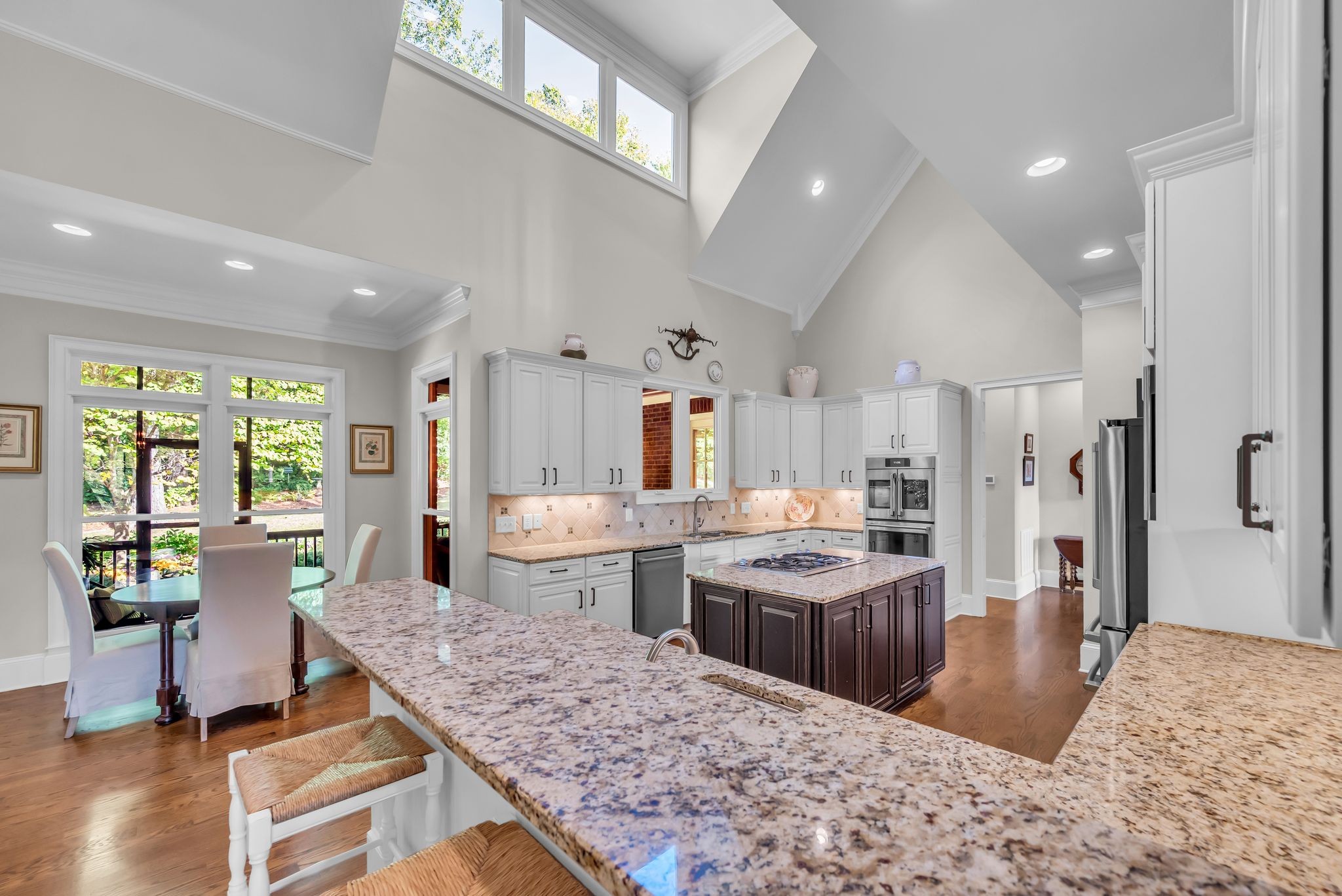 2449 Durham Manor Drive Franklin, TN 37064 - Photo 24 of 88 a large kitchen with cabinets table and chairs