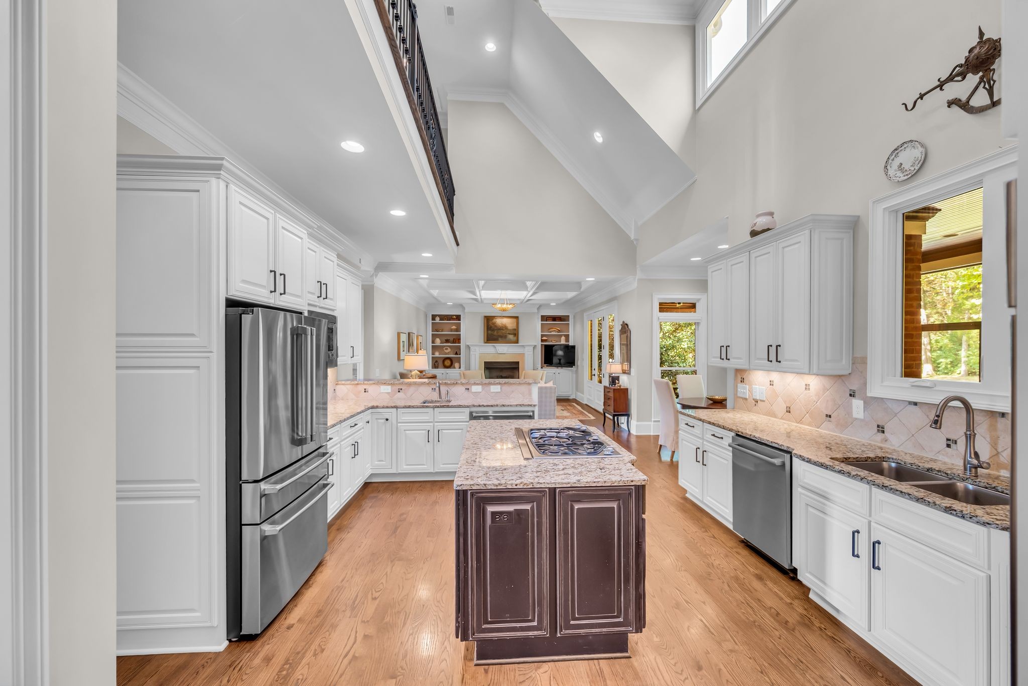 2449 Durham Manor Drive Franklin, TN 37064 - Photo 27 of 88 a large kitchen with stainless steel appliances a refrigerator a sink dishwasher a oven with white cabinets and wooden floor